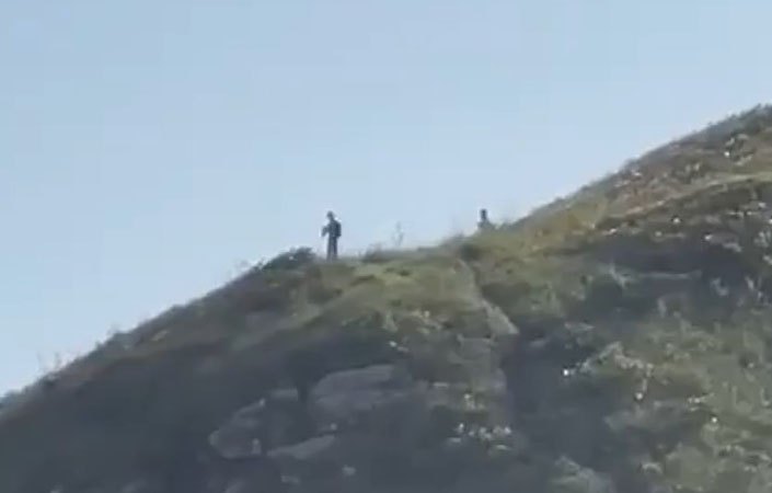 Hikers Film 'Ten Foot Tall Aliens' Standing on Brazil Cliff Edge