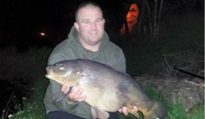 'Ghost' Photobombs Snap of Man with Freshly-Caught Fish