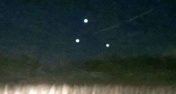 Witness Snaps Photo of Hovering Orbs in Triangular Formation