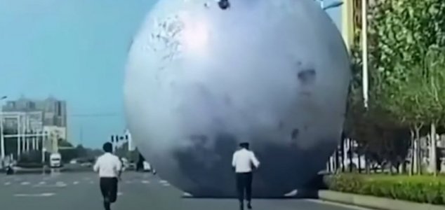 Giant Moon Escapes Festival, and Rolls Down Street in China