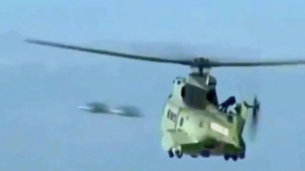 Two 'UFOs' Caught on Video Flying Past Military Helicopter