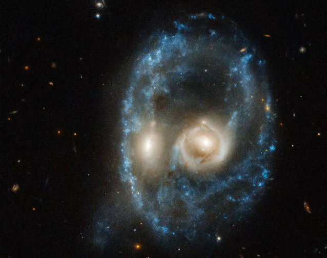 NASA Posts 'Ghost Face' Photo of Colliding Galaxies