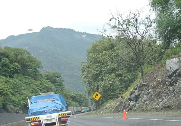Motorist Photographs 'UFO' Hovering over Hill in Mexico