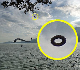 Tourist Snaps 'Doughnut-shaped UFO' Floating over Chinese Lake