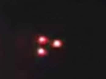 Melbourne Family Photographs Triangular 'UFO' over Their House